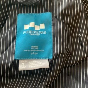 Foursquare Ski/Snowboard Jacket. Black insulated shell with snow skirt.